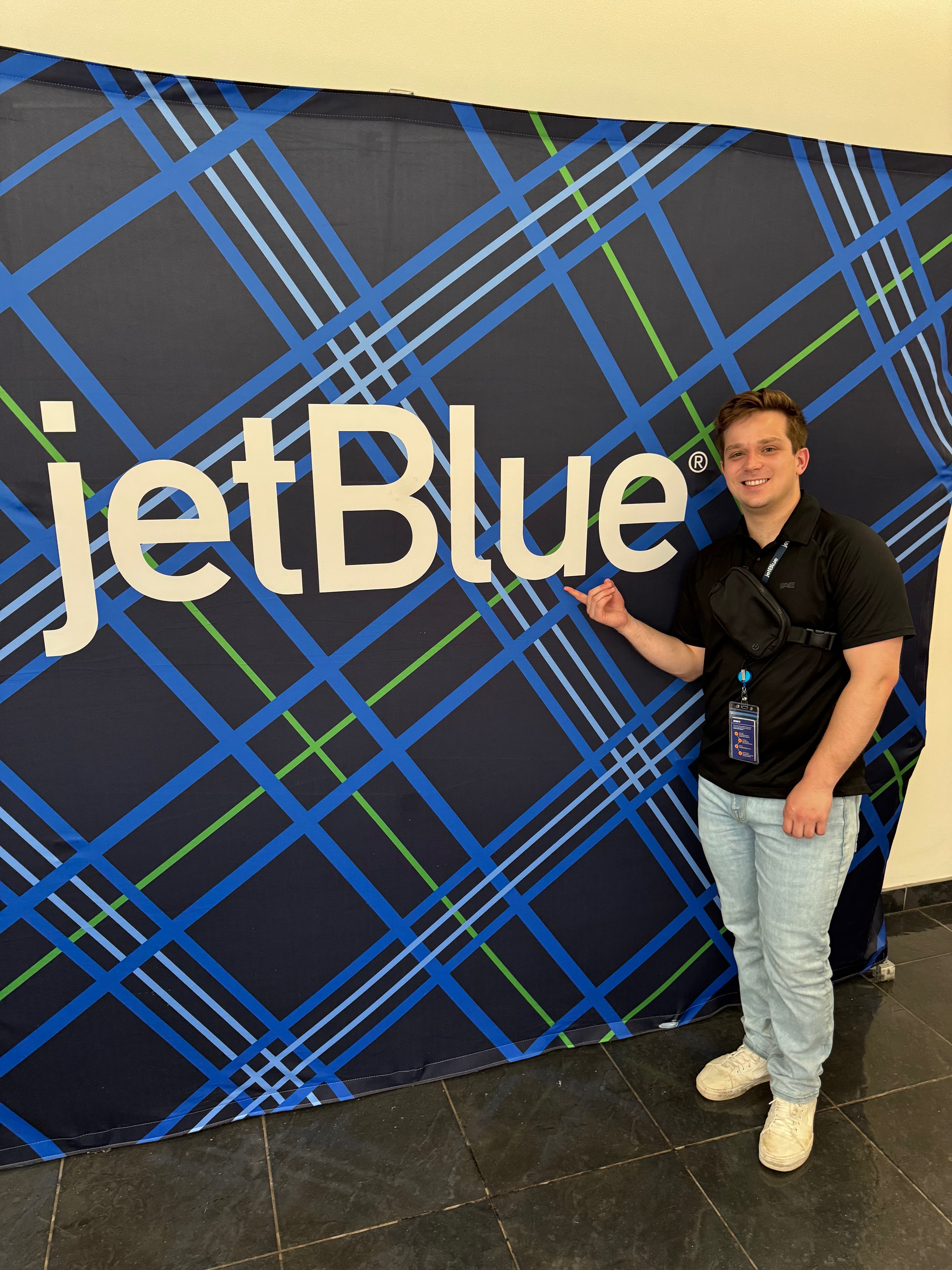 Me in front of a JetBlue backdrop
